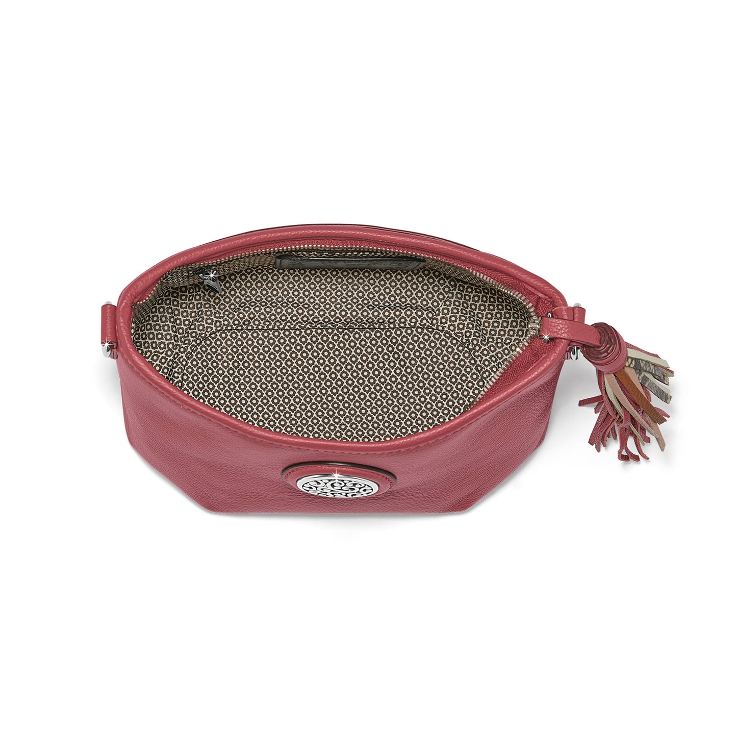Brighton red leather handbag shown open with patterned fabric lining, tassel zipper pull, and silver medallion on a white background