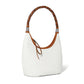 Brighton white handbag with braided brown leather strap and silver-tone scroll hardware accents on a white background