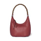 Brighton burgundy leather hobo handbag with braided multicolor top handle and silver-tone ornate accents on a white background