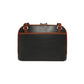 Brighton handbag shown from the back with black pebbled leather body and brown leather trim on a white background