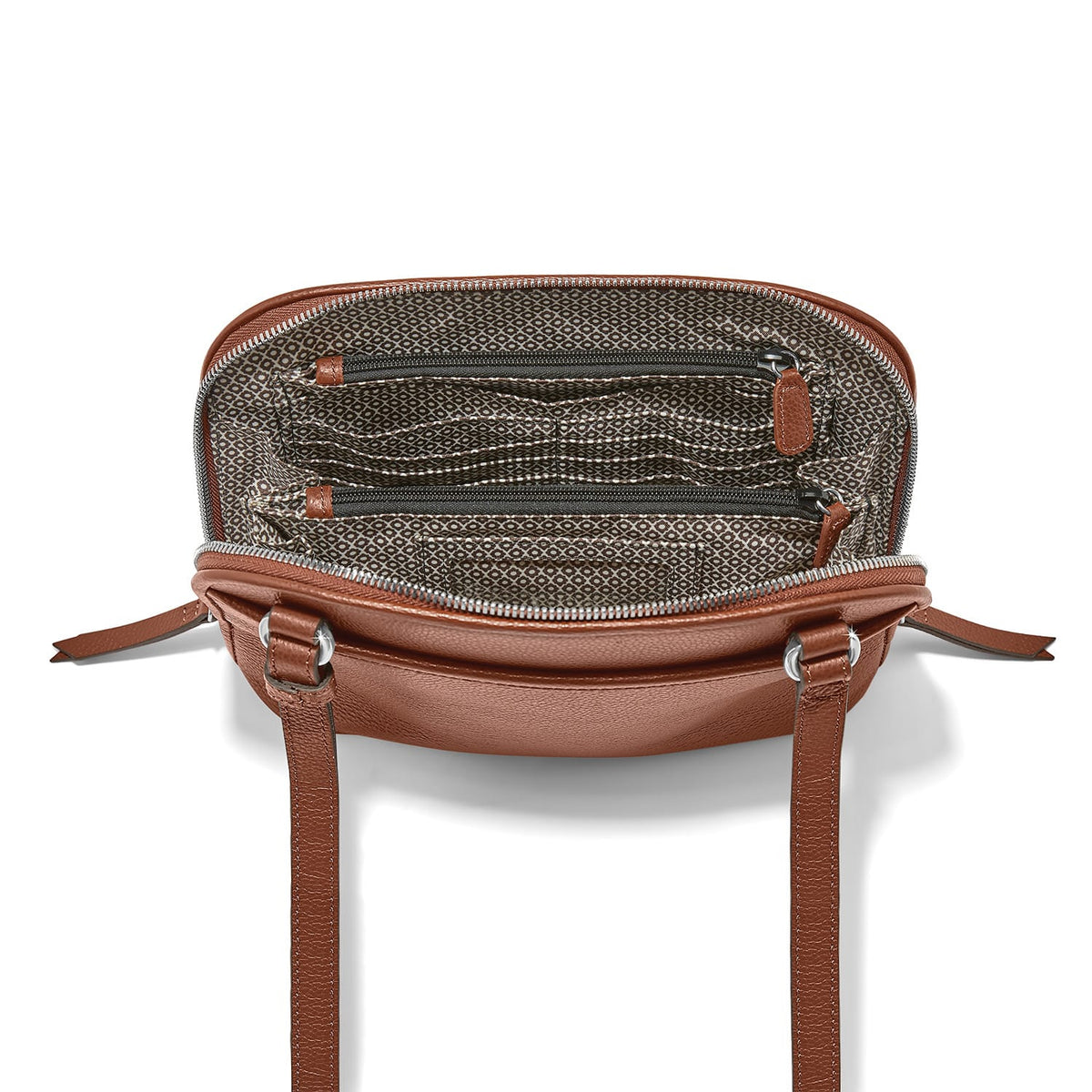 Brighton brown leather handbag shown open with patterned fabric lining, interior zip pockets, and shoulder straps on a white background