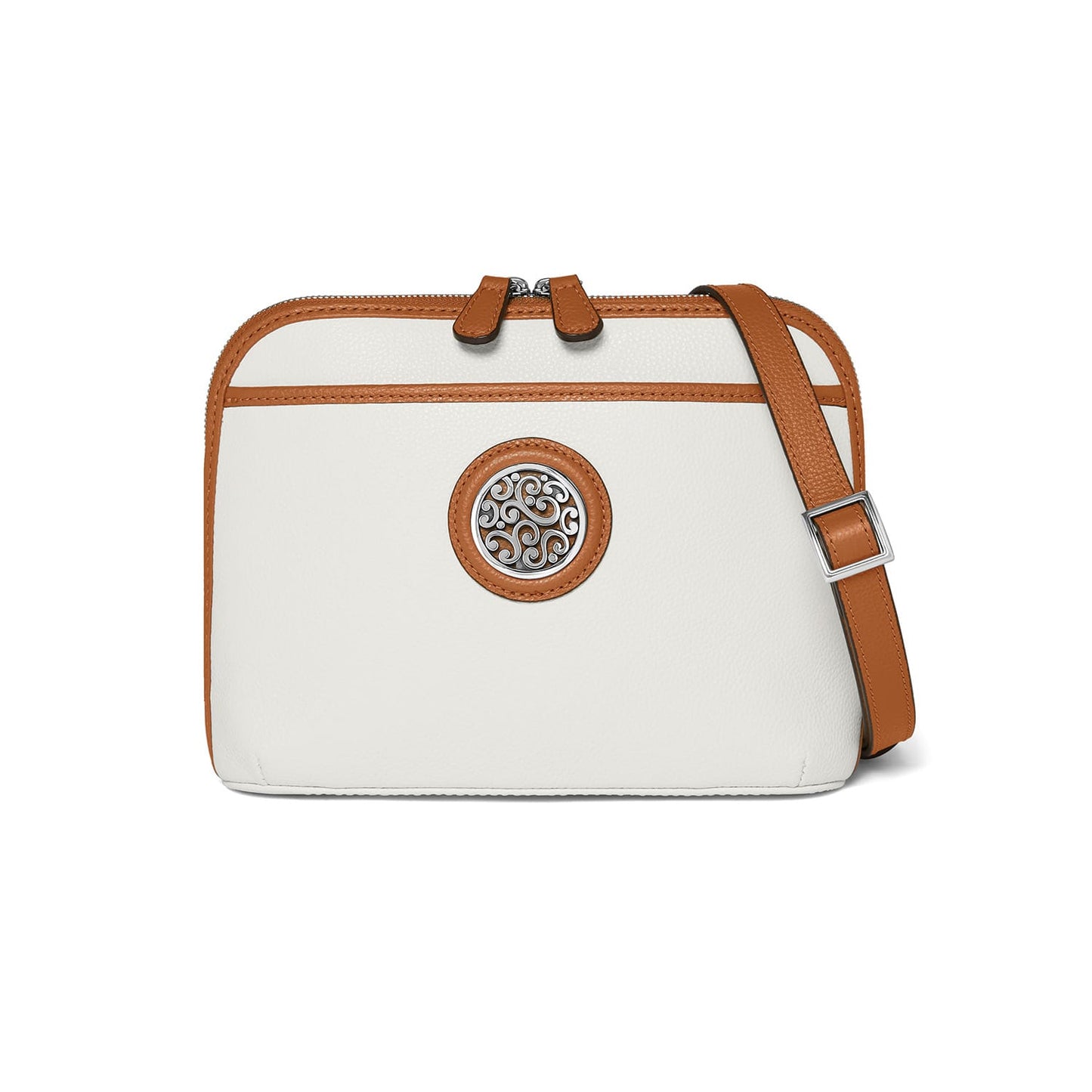 Brighton crossbody handbag in white with tan leather trim, silver-tone medallion, and adjustable strap on a white background