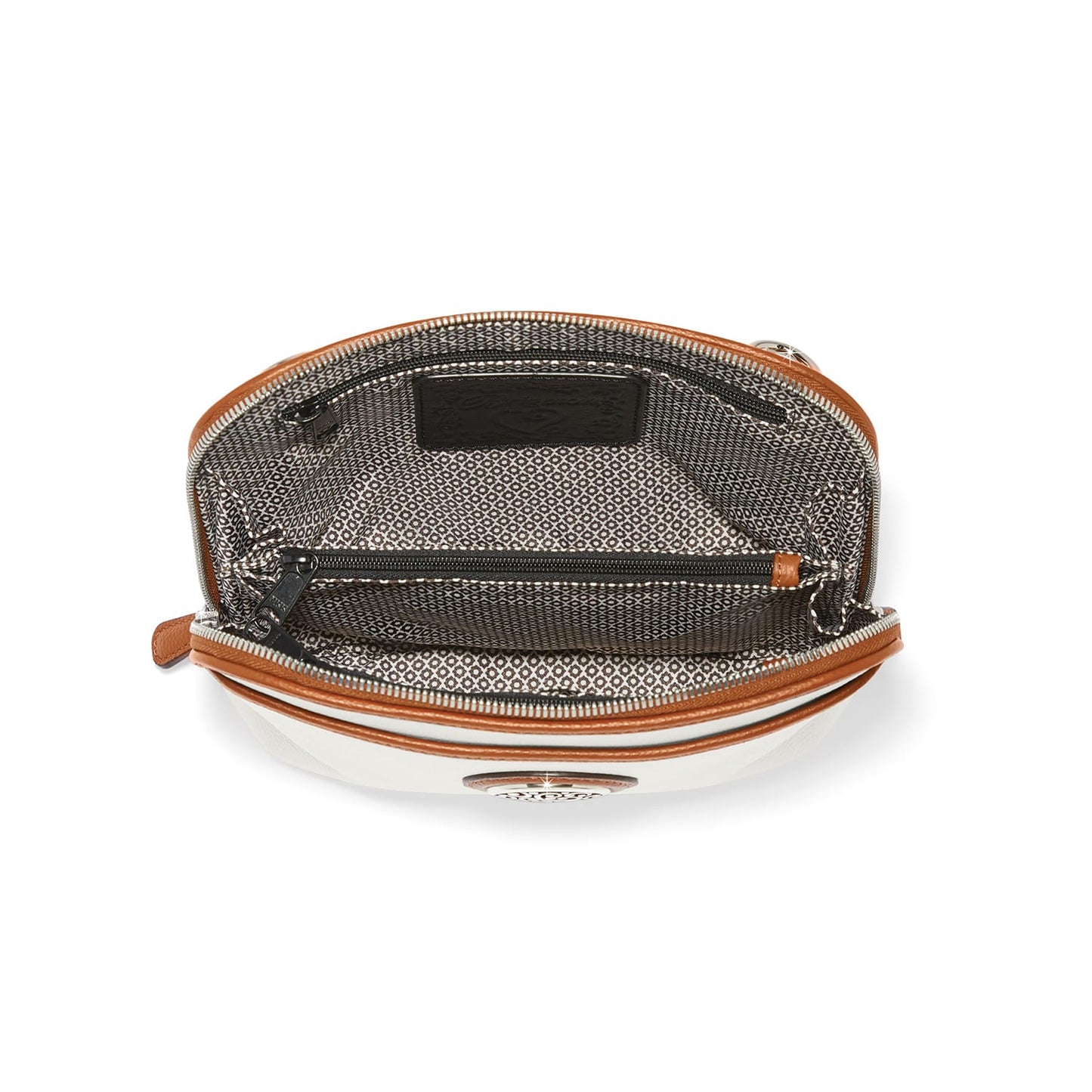 Close-up of Brighton handbag interior view showing patterned fabric lining, zippered pocket, and tan leather trim