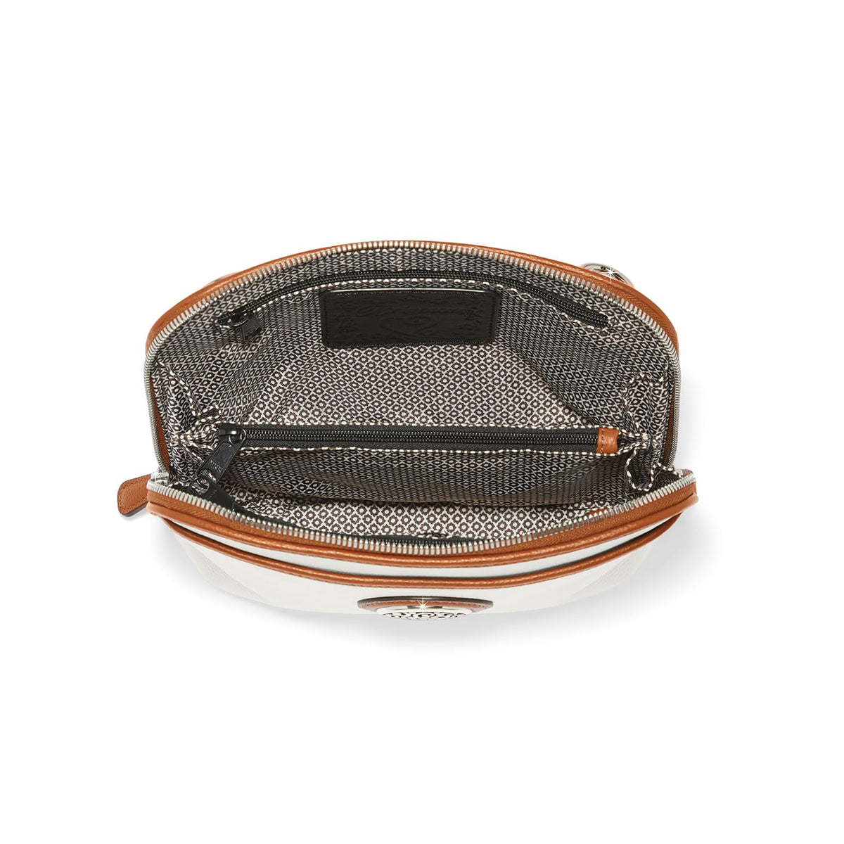 Close-up of Brighton handbag interior view showing patterned fabric lining, zippered pocket, and tan leather trim