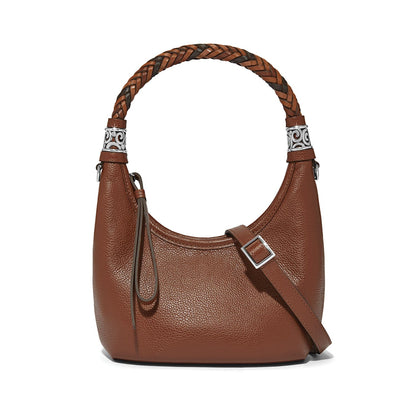 Brighton brown pebbled leather handbag with braided top handle, silver-tone scroll accents, and adjustable crossbody strap on a white background