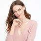 Model wearing a Brighton silver-plated heart pendant necklace with crystal accents and scroll detailing paired with crystal stud earrings