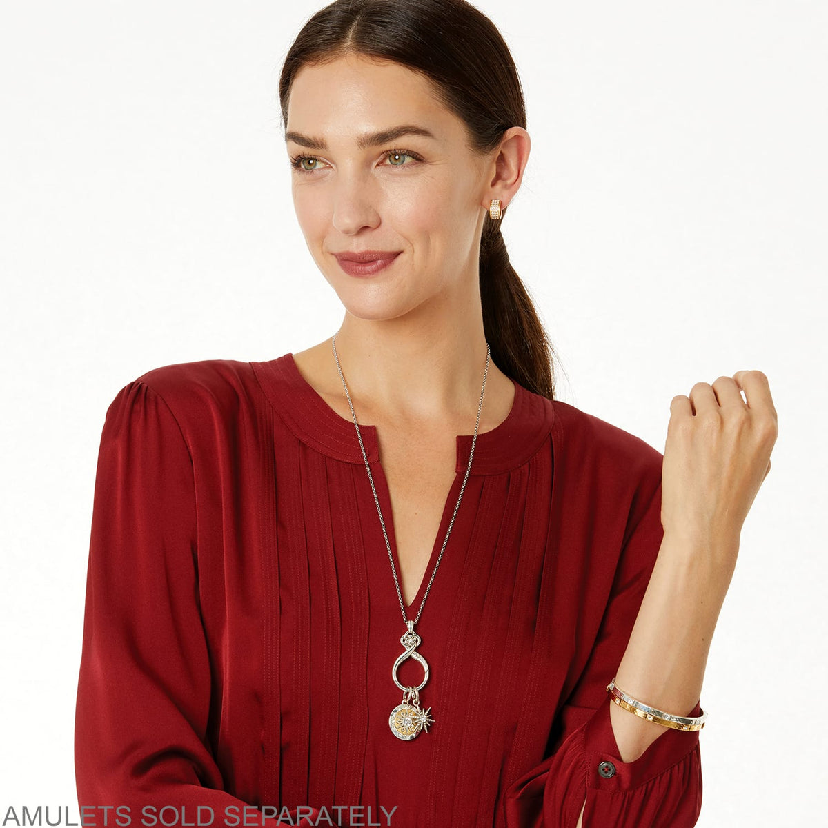 Model wearing a Brighton silver-plated pendant necklace with loop detail and coordinating Brighton accessories