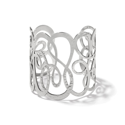 Brighton wide cuff bracelet with silver-plated hammered swirling openwork loop design on a white background