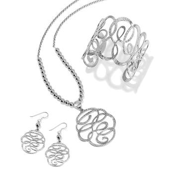 Brighton silver-plated jewelry set styled with hammered scroll pendant necklace, matching drop earrings, and cuff bracelet