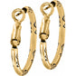 Brighton hoop earrings in gold-plated finish with engraved scroll and dot detailing along the hoops on a white background