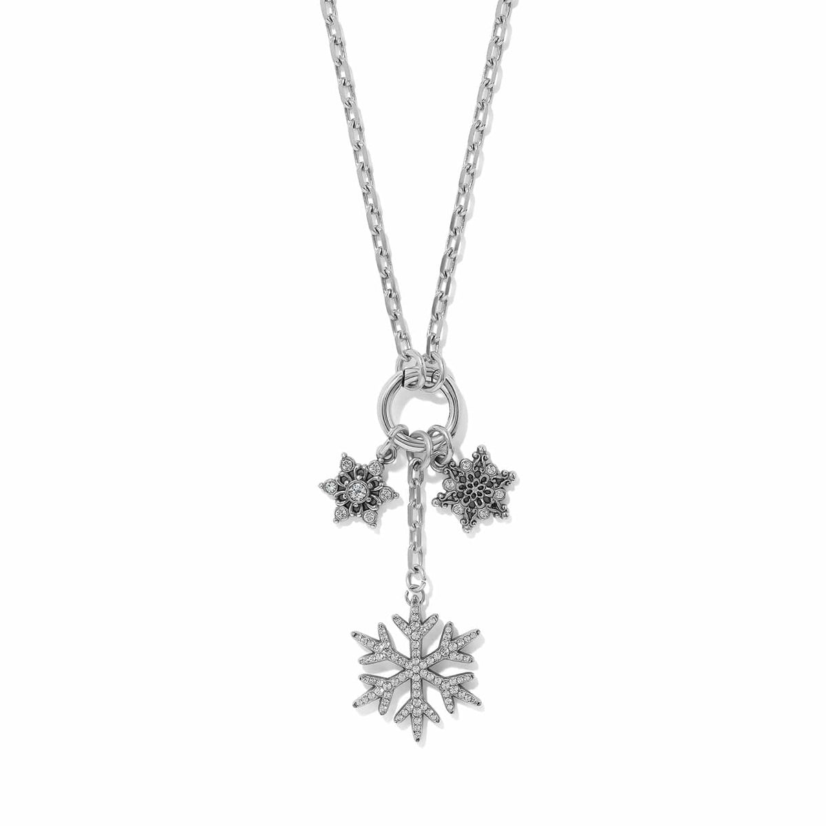 Brighton silver-plated charm necklace with three snowflake pendants and crystal accents on a white background