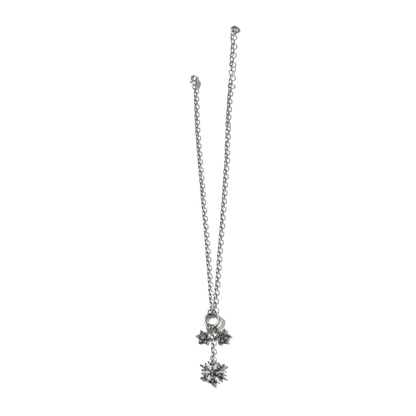 Brighton silver-plated necklace with snowflake and star charms featuring fine quality crystals on a white background