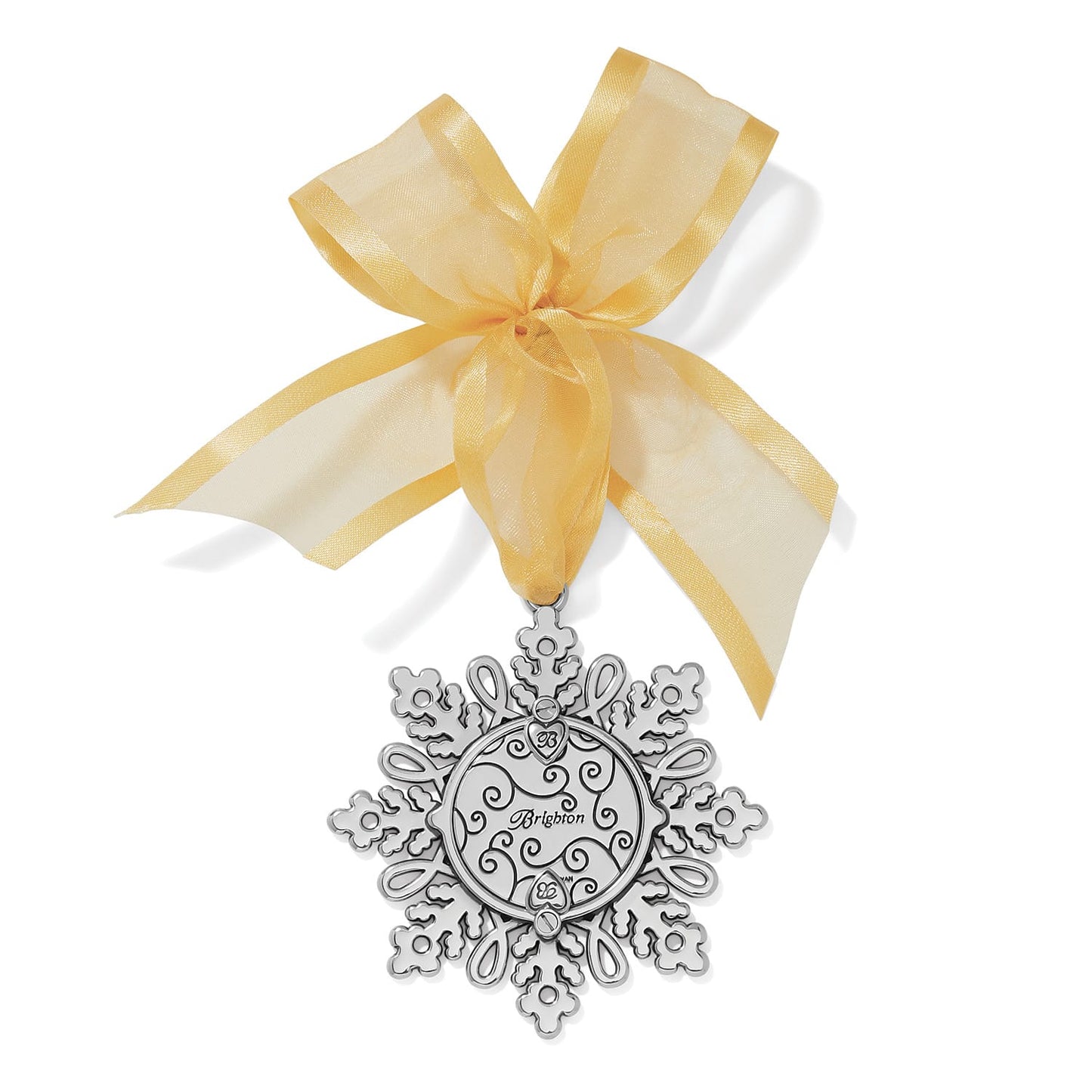 Brighton silver-plated snowflake ornament with engraved scrollwork center medallion and sheer gold ribbon bow on a white background