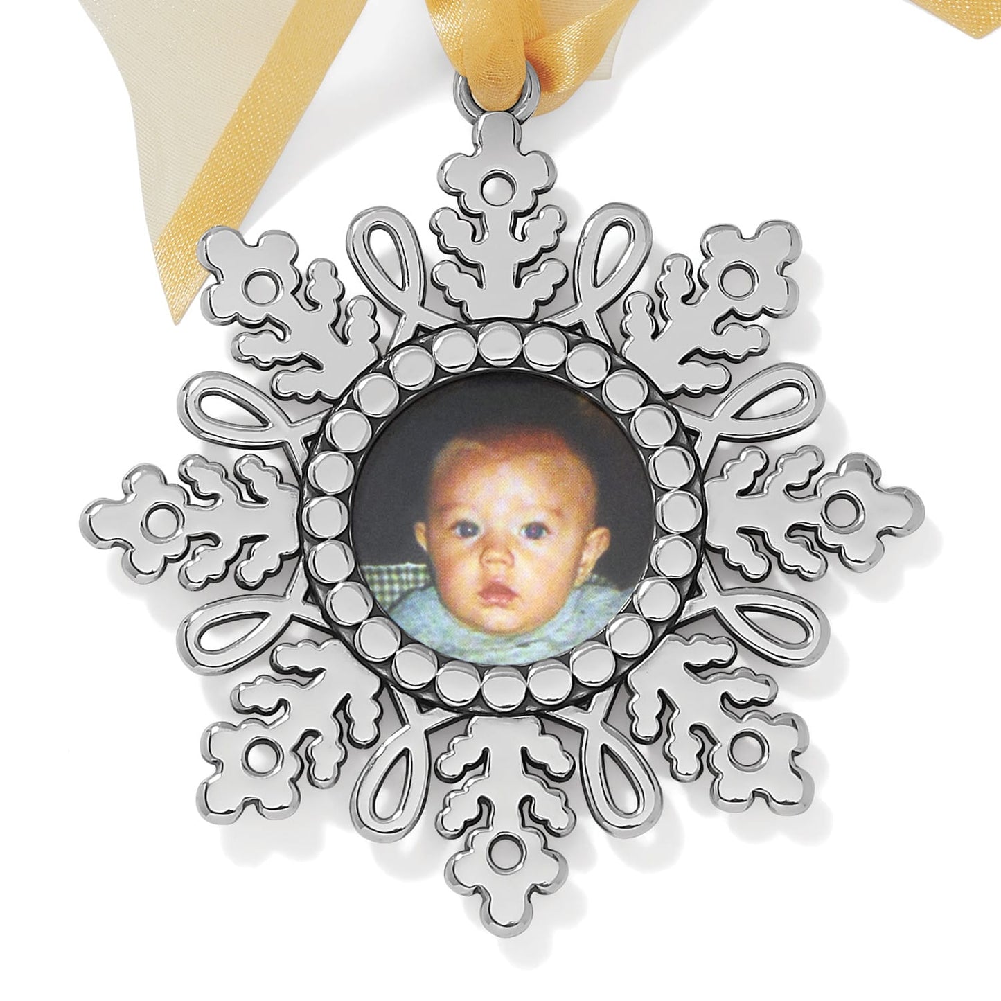 Brighton snowflake photo ornament with silver-plated finish, beaded photo frame, and yellow ribbon on a white background