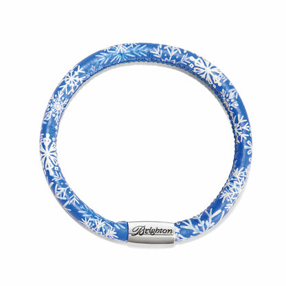 Brighton leather bracelet with blue and white snowflake print and silver-plated magnetic clasp on a white background