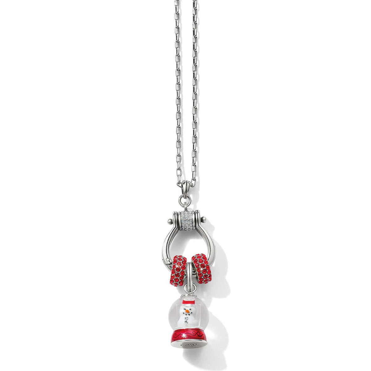 Brighton charm necklace with silver-plated ring holder, red crystal rings, and enamel snow globe snowman charm on a white background