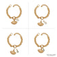 Brighton gold-plated charm bracelet shown with mother of pearl shell and shell-shaped charms on a white background