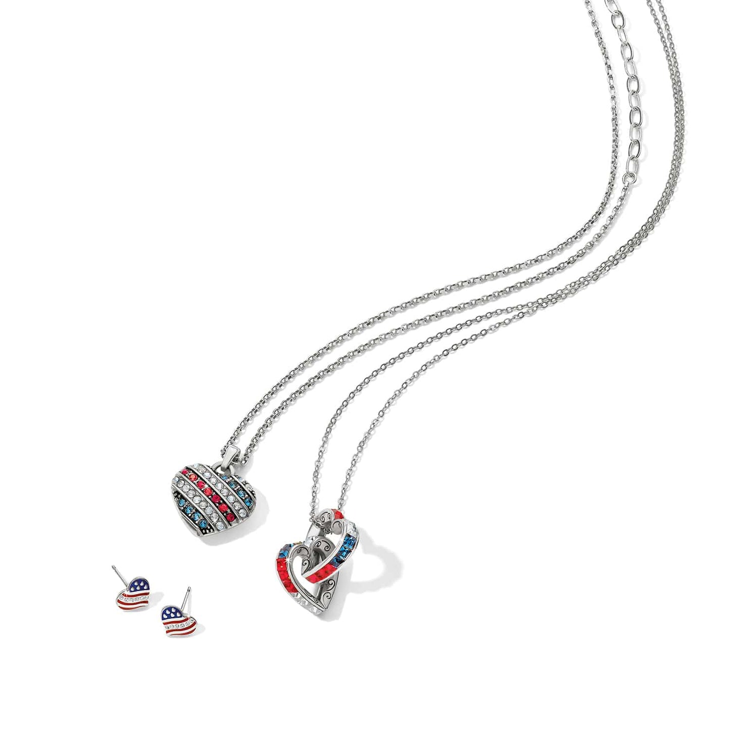 Brighton silver-plated heart necklaces and stud earrings styled with red, white, and blue crystals on white background