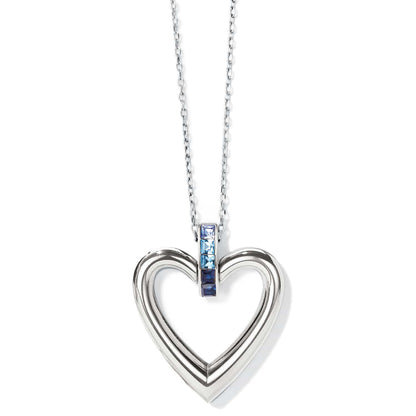 Brighton pendant necklace with silver-plated open heart and blue crystal accents on a white background
