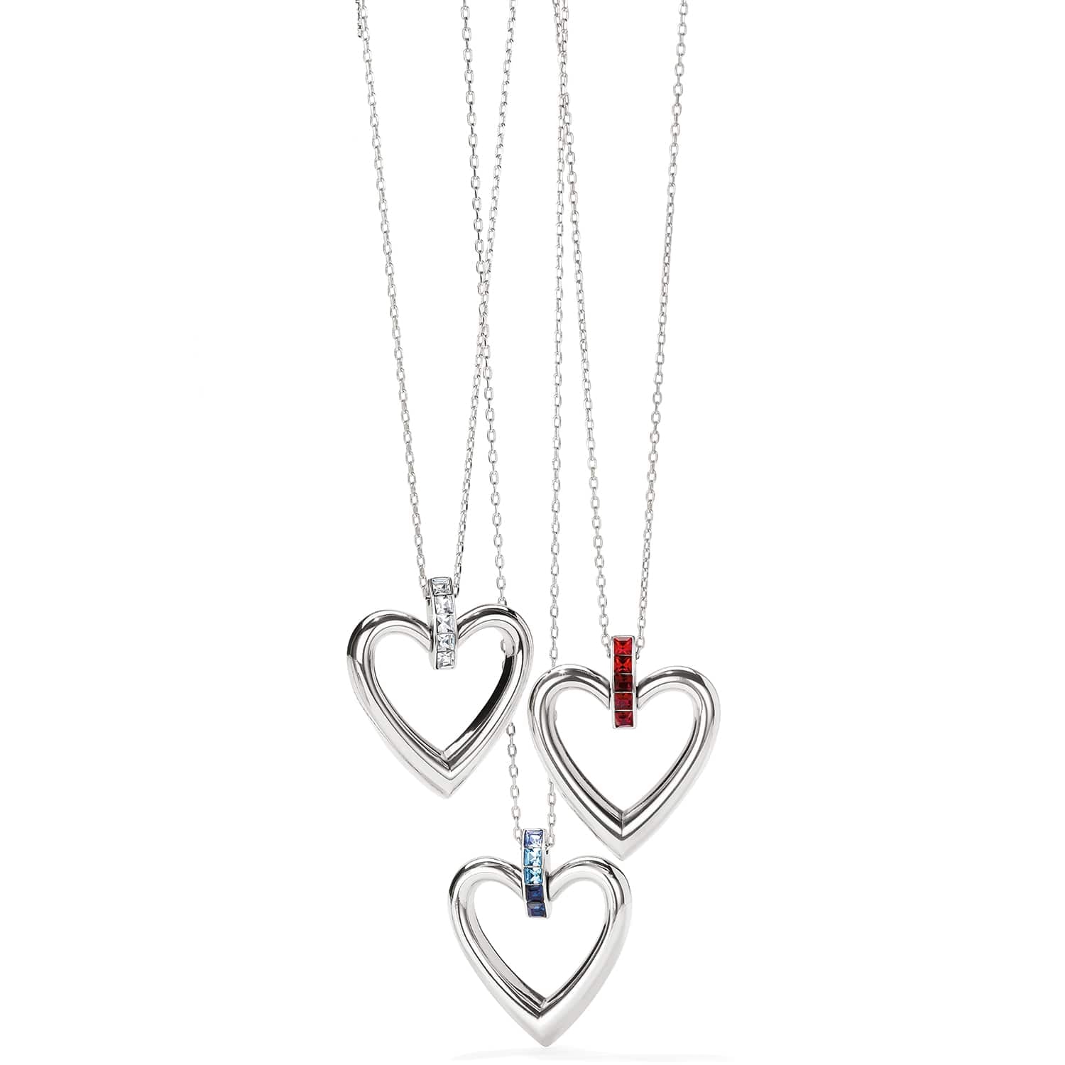 Brighton heart pendant necklaces with silver-plated open hearts and clear, red, and blue crystal accents on a white background