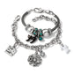 Brighton silver-plated Halloween charm bracelets with black cat, ghost, spider web, and teal crystal accents on a white background
