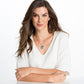 Model wearing a Brighton silver-plated pendant necklace with ornate openwork medallion and delicate chain