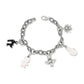 Brighton silver-plated charm bracelet with Halloween-themed enamel charms including spider, bat, and ghost on a white background