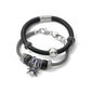 Brighton bracelets with black leather band, silver-plated mesh chain, crystal charms, and spider pendant on a white background