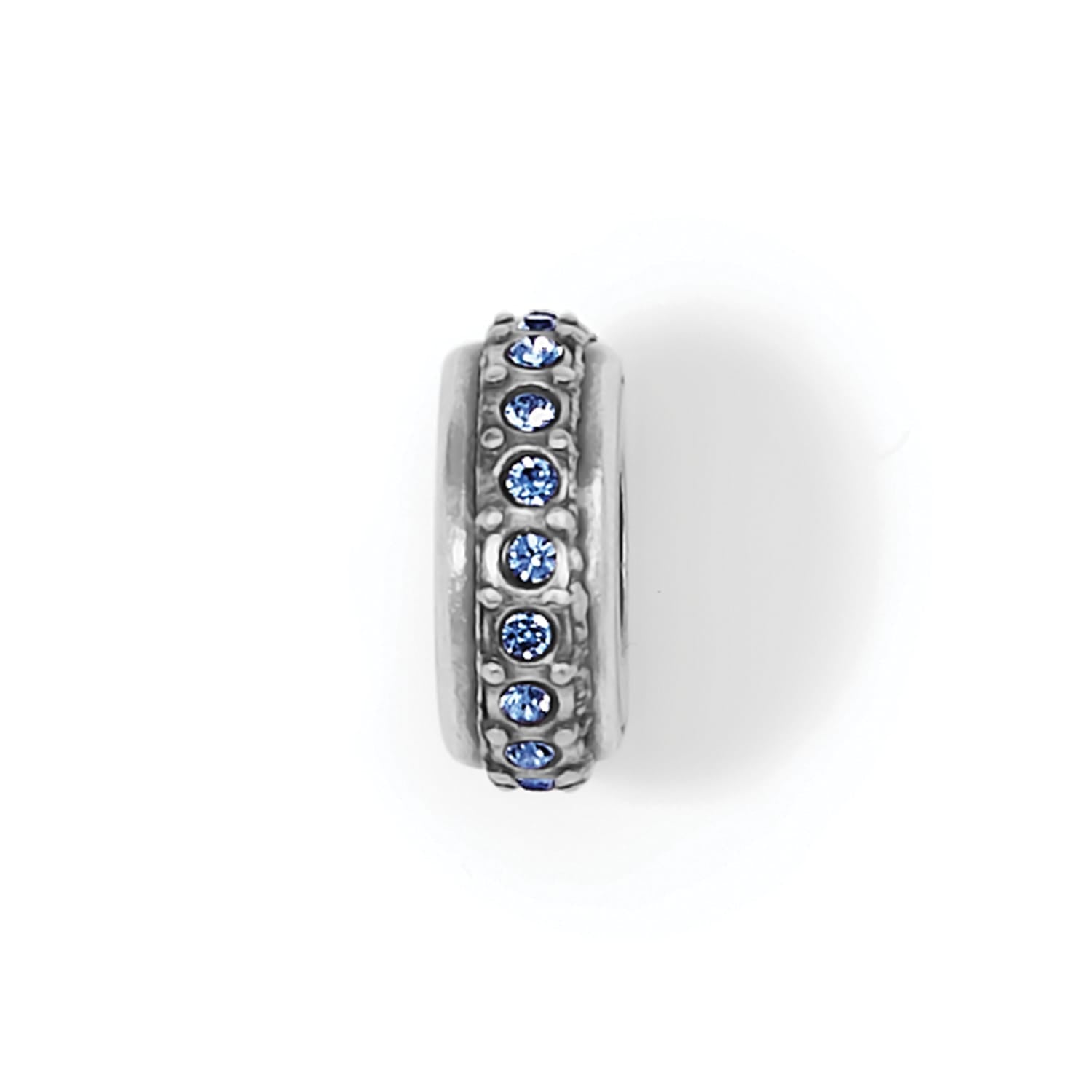 Brighton spacer charm with silver-plated finish and row of blue crystals around the band on a white background