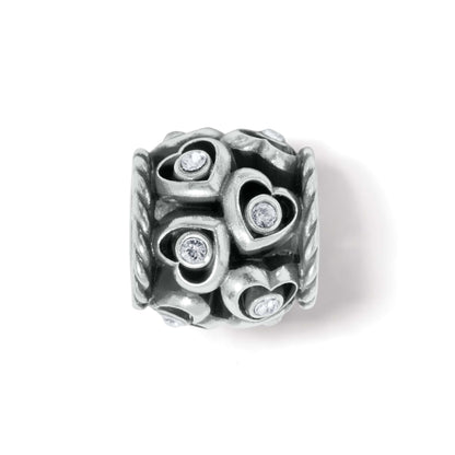Brighton silver-plated charm bead with heart cutouts, crystal accents, and rope-textured edges on a white background