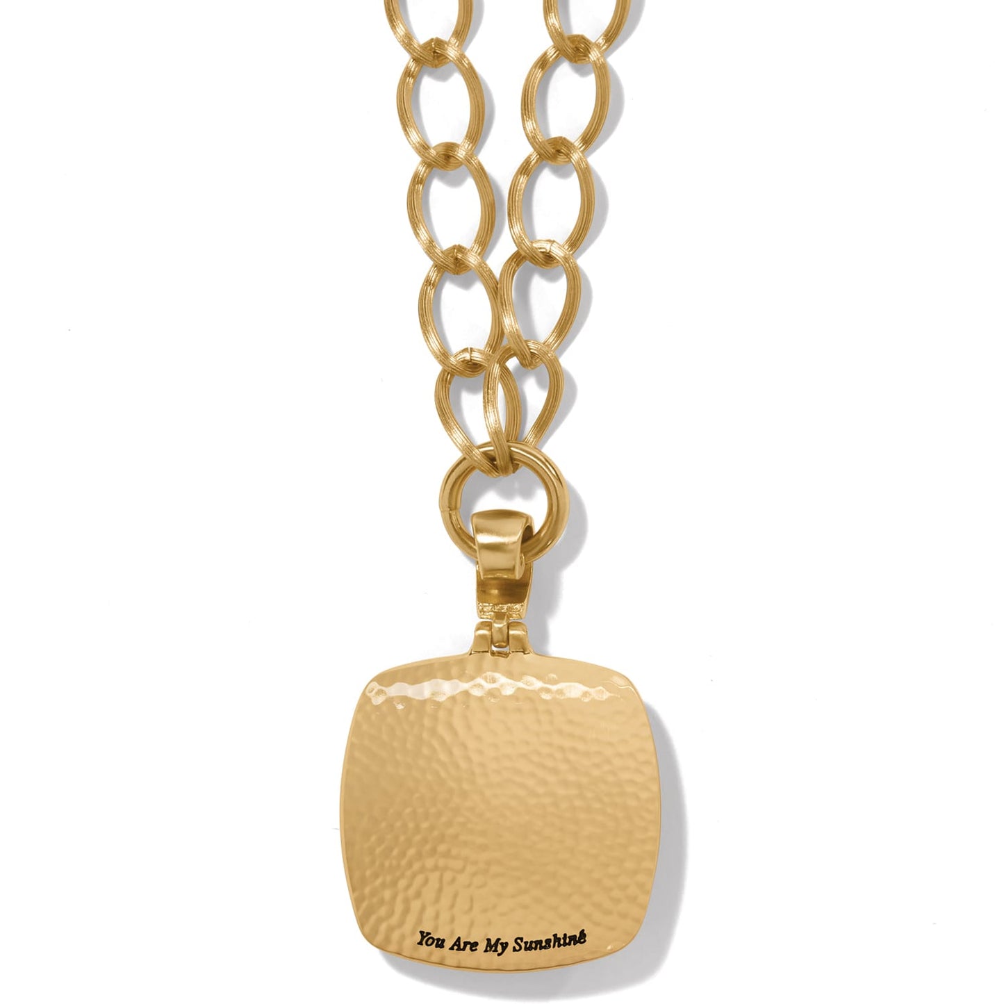 Brighton pendant necklace shown from the back with hammered brushed gold finish and engraved inscription on a white background