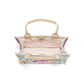 Brighton handbag interior view showing pink patterned lining, zip pocket, and tan leather handle accents on a white background