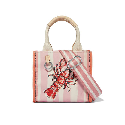 Brighton handbag with pink striped canvas, embroidered red lobster, rolled handles, and adjustable crossbody strap on a white background