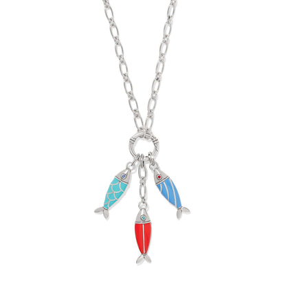 Brighton charm necklace with three enamel fish charms in turquoise, red, and blue on a white background