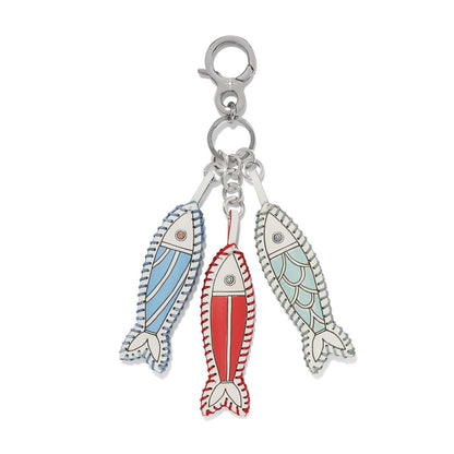 Brighton bag charm with three leather fish in blue, red, and green with whipstitch edges on a white background