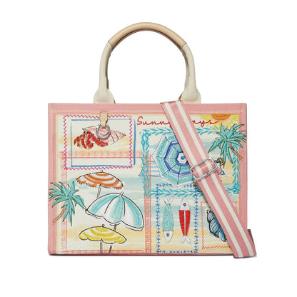 Brighton handbag with pink trim, beach-themed embroidered print of umbrellas, palms, and fish, striped strap on a white background