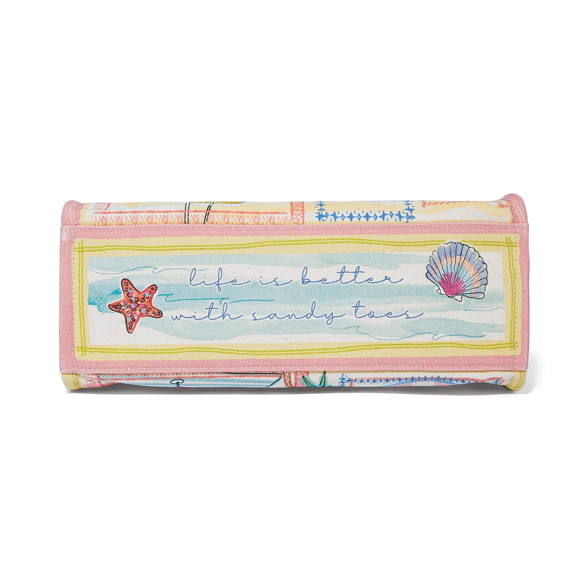 Brighton handbag bottom view with pastel seashell print and script reading life is better with sandy toes on a white background