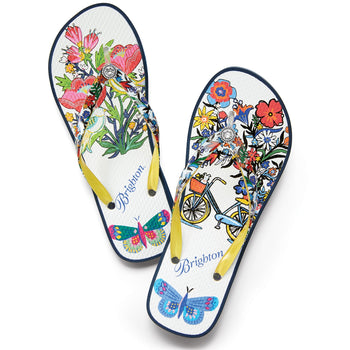 Brighton rubber flip-flop sandals with floral, bicycle, and butterfly print, yellow straps, and crystal accents on a white background