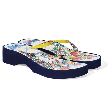 Brighton flip-flop sandals with navy rubber platform, floral print footbed, and yellow straps with crystal accent on a white background