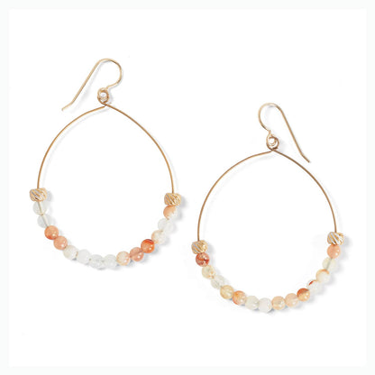 Brighton hoop earrings with gold-plated wire, peach and white beads, and ribbed metal accents on a white background