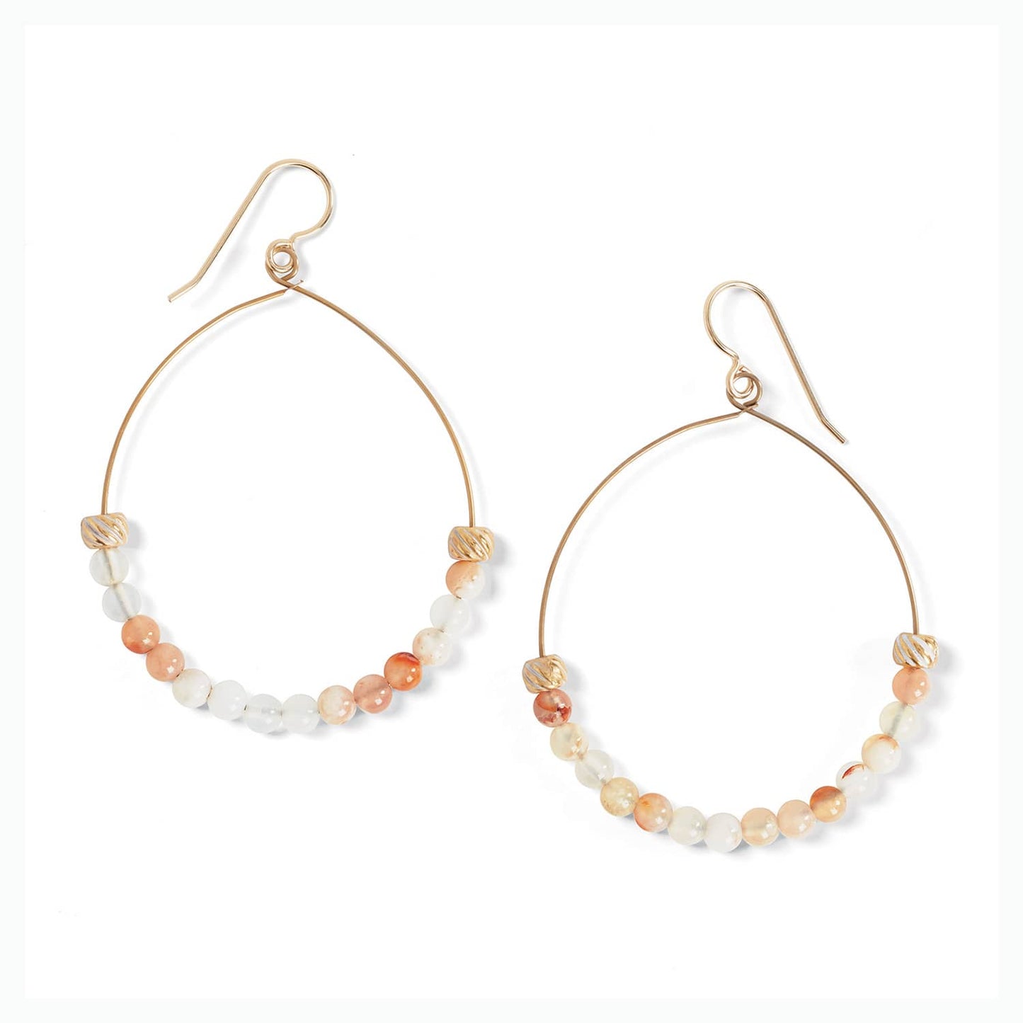 Brighton hoop earrings with gold-plated wire, peach and white beads, and ribbed metal accents on a white background