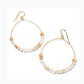 Brighton hoop earrings with gold-plated wire, cream and peach beads, and decorative gold accents on a white background