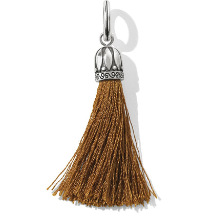 Brighton tassel charm with mustard yellow threads and silver-plated decorative cap with scroll detail on a white background