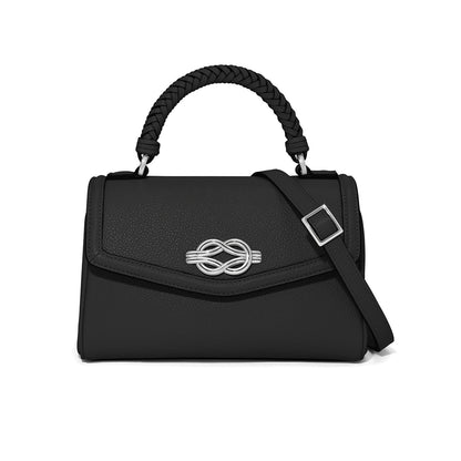 Brighton black handbag with braided top handle, silver-tone knot clasp, and adjustable shoulder strap on a white background
