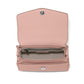 Brighton pink leather handbag shown open with patterned interior lining, zip pocket, and silver-tone snap closure on a white background