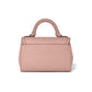 Brighton handbag shown from the back in pink pebbled leather with braided top handle on a white background