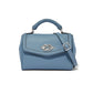 Brighton blue leather handbag with braided top handle, silver-tone knot clasp, and adjustable crossbody strap on a white background