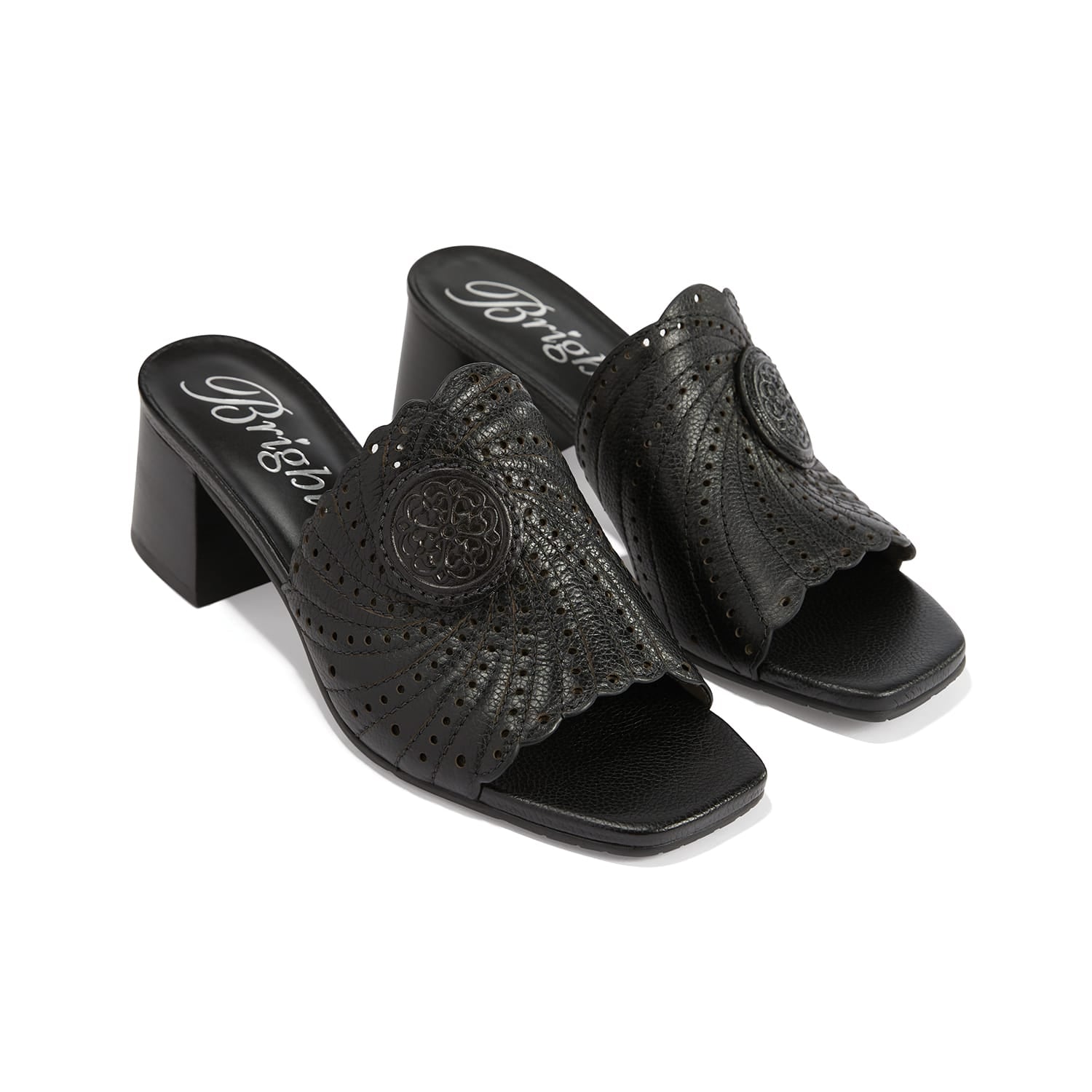 Brighton black leather block heel slide sandals with perforated scalloped detail and medallion accent on a white background