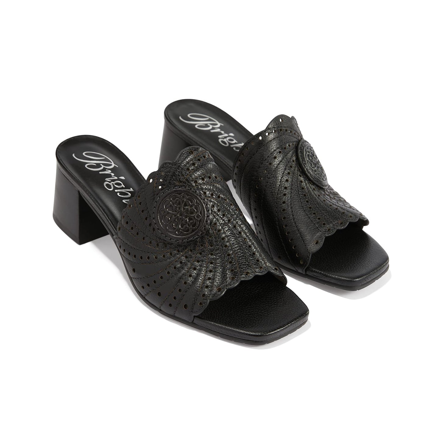 Brighton black leather block heel slide sandals with perforated scalloped detail and medallion accent on a white background