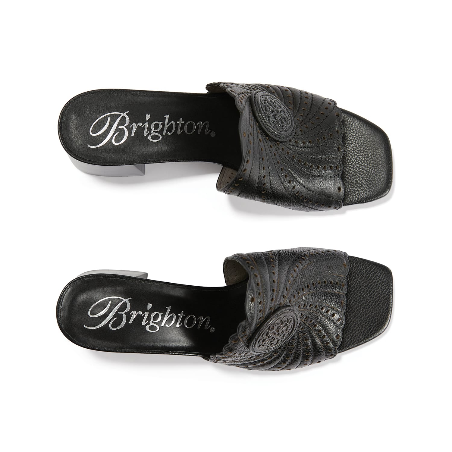 Brighton black leather slide sandals with swirl stitching, perforated detail, and medallion accent on a white background